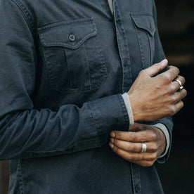 fit model adjusting cuffs on The Saddler Shirt in Washed Coal, Wovens by Taylor Stitch