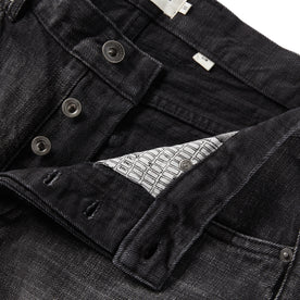 material shot of the button fly on The Slim Jean in Black 3-Month Wash Selvage, Bottoms by Taylor Stitch