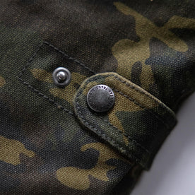 material shot of the cinch clasp on The Workhorse Vest in Camo Boss Duck, Outerwear by Taylor Stitch