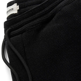 material shot of the drawstrings on The Apres Pant in Coal Waffle, Bottoms by Taylor Stitch