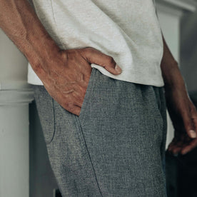 fit model with his hand in his pocket of The Apres Pant in Heather Grey Double Cloth, Bottoms by Taylor Stitch