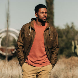 our fit model wearing The Welterweight Winslow in Field Tan Waxed Canvas out in the desert—cropped shot looking left, Outerwear by Taylor Stitch