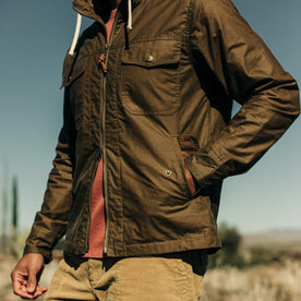 our fit model wearing The Welterweight Winslow in Field Tan Waxed Canvas out in the desert—cropped shot of chest, Outerwear by Taylor Stitch