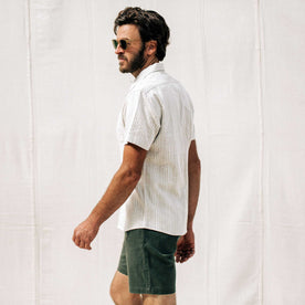 our fit model wearing The Short Sleeve Hawthorne in Natural Stripe, Wovens by Taylor Stitch