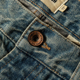 material shot of The Democratic Jean in 24-Month Wash Japanese Selvage—button close up, Denim by Taylor Stitch