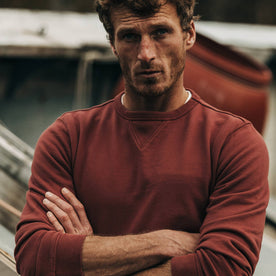 fit model wearing The Crewneck in Brick Red Terry, arms crossed, Knits by Taylor Stitch