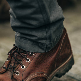 fit model wearing The Morse Pant in Charcoal Slub Linen, detail shot over boot, Bottoms by Taylor Stitch