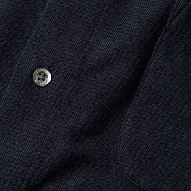 material shot of button, Knits by Taylor Stitch