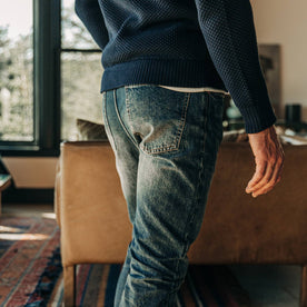 fit model wearing The Slim Jean in Organic Selvage 12-month Wash, back pocket shot, Bottoms by Taylor Stitch