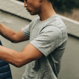 our fit model wearing The Merino Tee—in our grey colorway, cropped shot of shoulder, Knits by Taylor Stitch