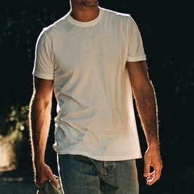 our fit model wearing The Standard Issue Tee in Natural Hemp—cropped shot chin down, Knits by Taylor Stitch