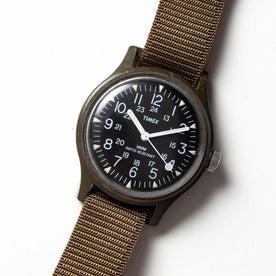 flatlay of the 1991 Timex Camper, shown close up, Accessories by Taylor Stitch