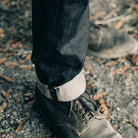 fit model wearing The Democratic Jean in Black Over-dye Selvage, cuffed bottom, Bottoms by Taylor Stitch