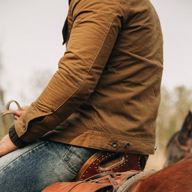 fit model wearing The Lined Long Haul Jacket in Harvest Tan Dry Wax, side, Outerwear by Taylor Stitch