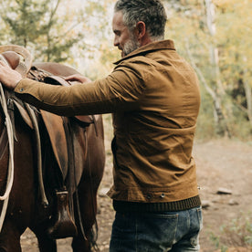 fit model wearing The Lined Long Haul Jacket in Harvest Tan Dry Wax, back, Outerwear by Taylor Stitch