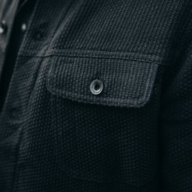 fit model wearing The Long Haul Jacket in Black Indigo Sashiko—cropped shot of chest button, Outerwear by Taylor Stitch