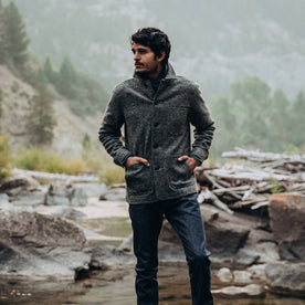 our fit model wearing The Ojai Jacket in Charcoal Wool—standing near a creek, Outerwear by Taylor Stitch