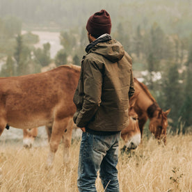 our fit model wearing The Welterweight Winslow in Olive Dry Waxed Canvas—looking out to valley, Outerwear by Taylor Stitch