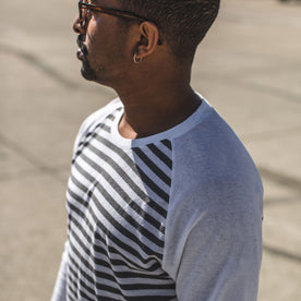 Our fit model wearing a stripe baseball tee, Knits by Taylor Stitch