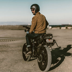 Our fit model on his bike, Outerwear by Taylor Stitch