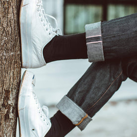 Fit model with cuffed denim and white shoes, Denim by Taylor Stitch