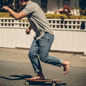 Our fit model skateboarding in his jeans , Denim by Taylor Stitch