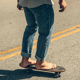 The fit model showing the back of the denim skateboarding in SF., Denim by Taylor Stitch