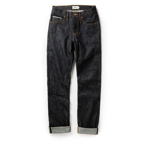 flatlay of The Democratic Jean in Natural Indigo Selvage, shown in full, Bottoms by Taylor Stitch