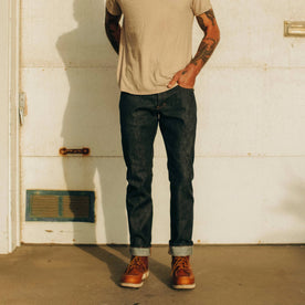 fit model standing in The Slim Jean in Natural Indigo Selvage, Bottoms by Taylor Stitch