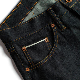 material shot of the pockets and hardware on The Slim Jean in Natural Indigo Selvage, Bottoms by Taylor Stitch