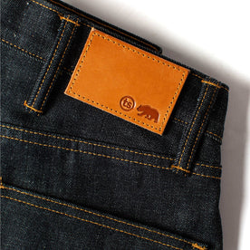 material shot of the leather patch on The Slim Jean in Natural Indigo Selvage, Bottoms by Taylor Stitch