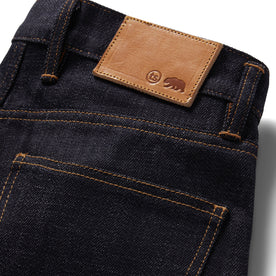 material shot of the logo patch on The Democratic Jean in Kuroki Welterweight Slub, Bottoms by Taylor Stitch