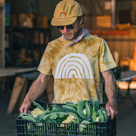 fit model holding a basket of produce in The Organic Cotton Tee in Ecology Center, Knits by Taylor Stitch