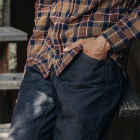 fit model with his hand in his pocket wearing The Democratic Jean in Cone Mills Cordura Denim, Bottoms by Taylor Stitch