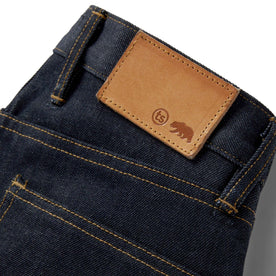 material shot of the back logo patch on The Democratic Jean in Cone Mills Cordura Denim, Bottoms by Taylor Stitch