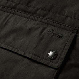 material shot of the pockets on The Ignition Vest in Coal Dry Wax, Outerwear by Taylor Stitch