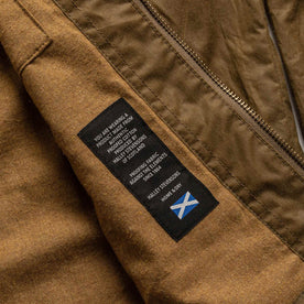 material shot of halley stevensons logo, Outerwear by Taylor Stitch