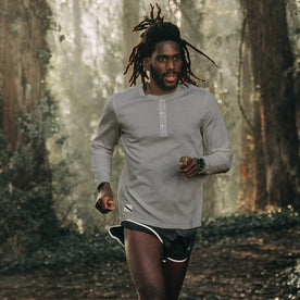 fit model wearing The Shoreline Henley in High Rise, running on trail, Knits by Taylor Stitch