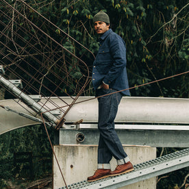 fit model wearing The Democratic Jean in Cone Mills Reserve Selvage, walking on dock, Denim by Taylor Stitch